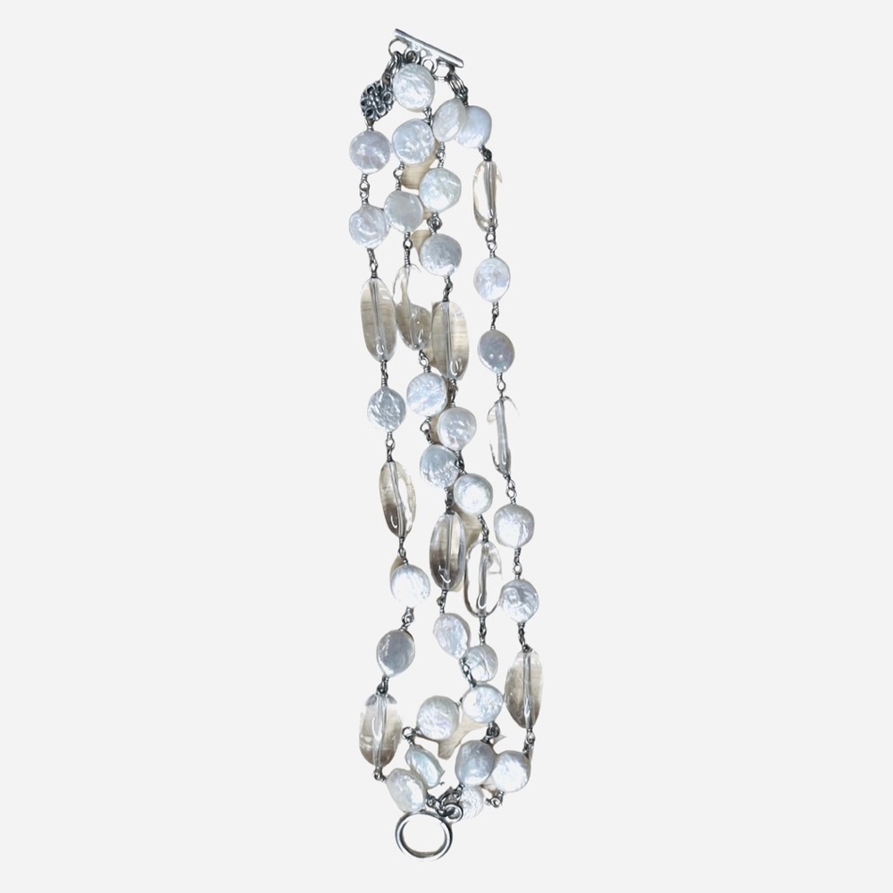 4-strand fresh water pearl bracelet, 7.75” long with clasp